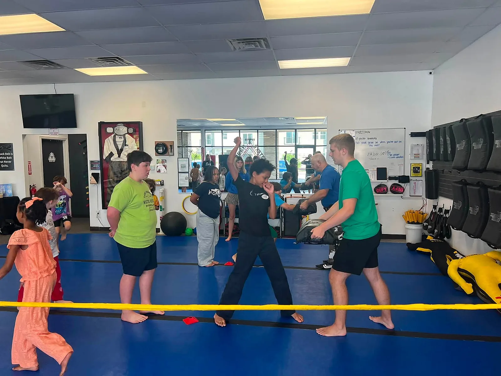 Students training on the blue mats at Super T Karate in Grand Rapids