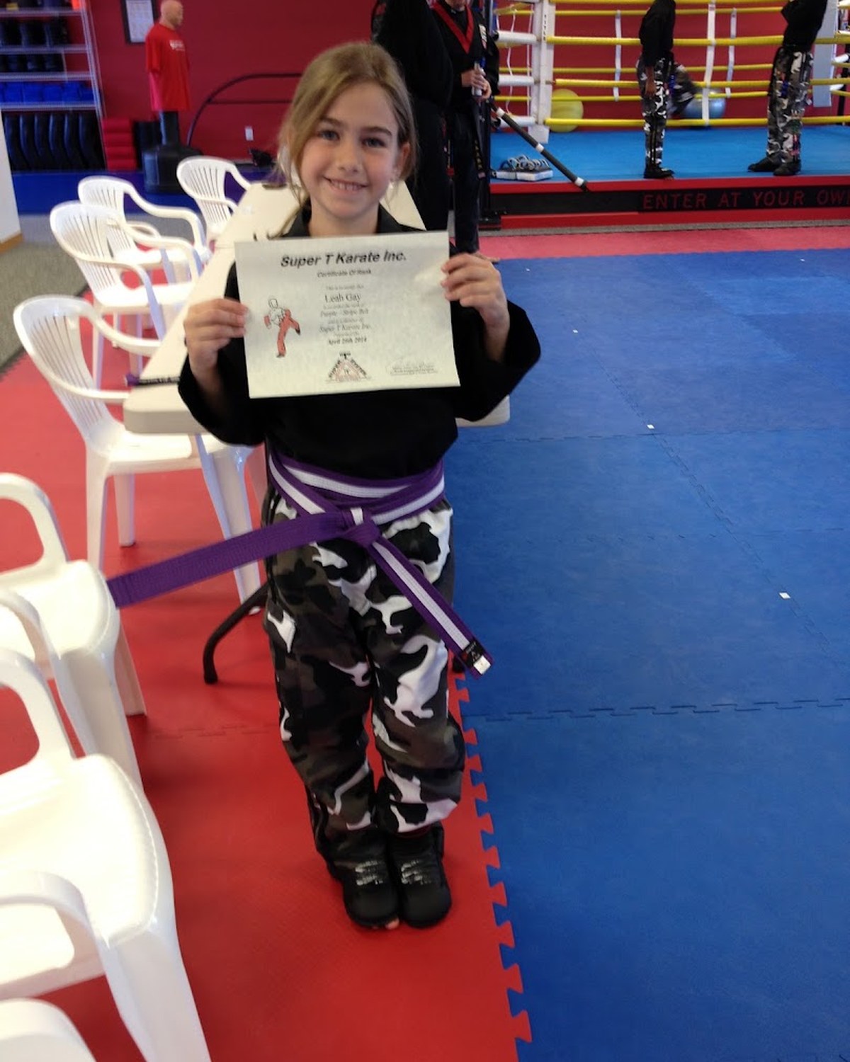 A Is Your Child student smiling proudly after class at Super T Karate in Grand Rapids