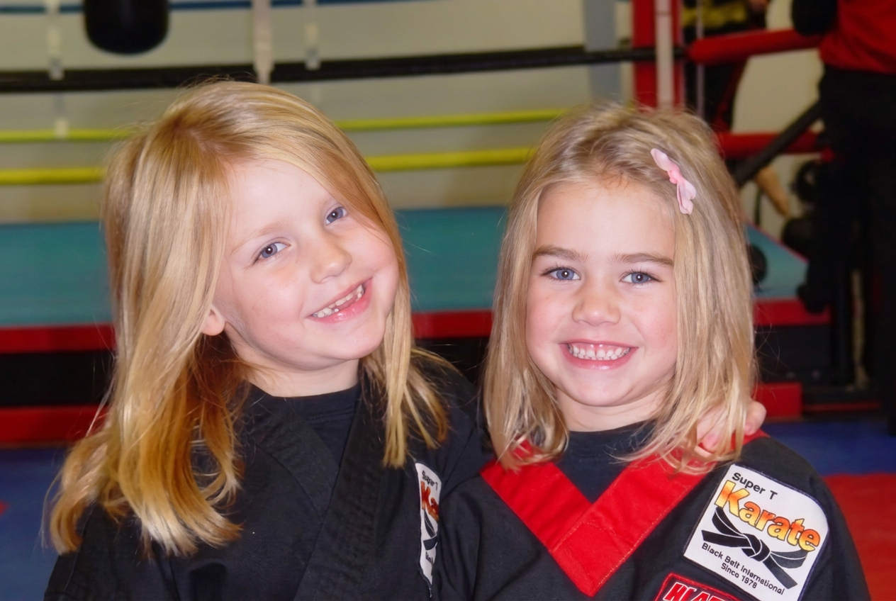 Two young Super T Tigers students in uniform at Super T Karate in Grand Rapids
