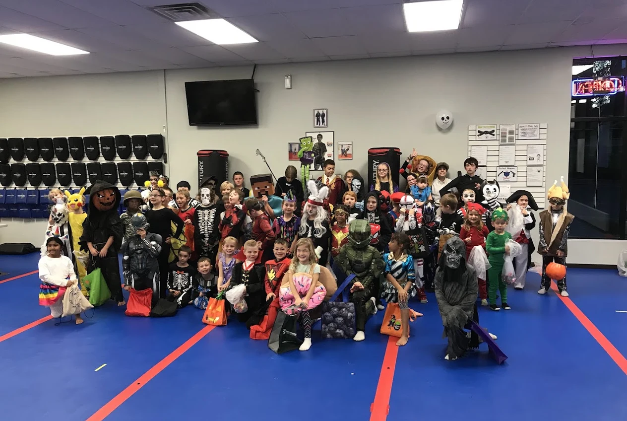 Students of all ages lined up together after class at Super T Karate in Grand Rapids